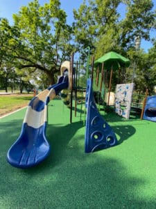 A jungle gym and slide on the playground