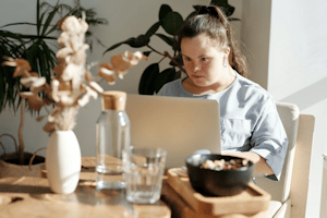 A concentrated girl working on her computer