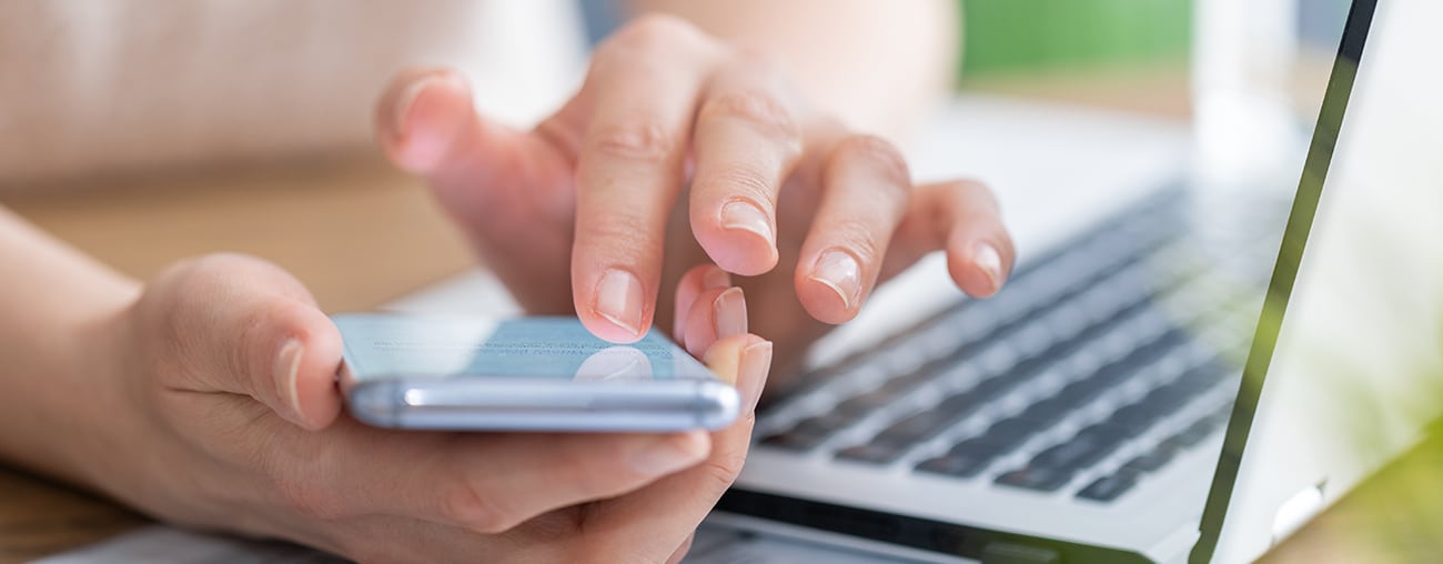 Person scrolling a mobile device.