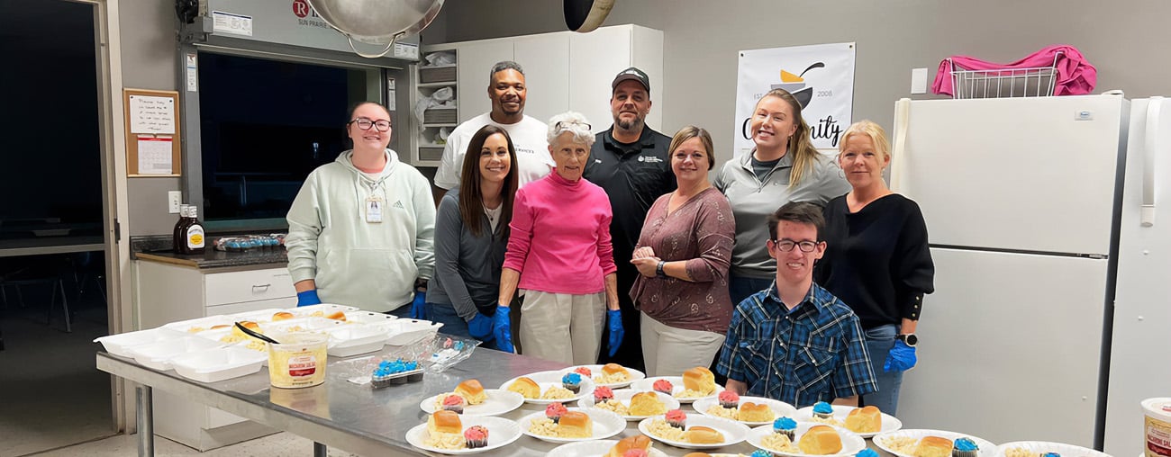 A group from CHS working together to make meals for the community