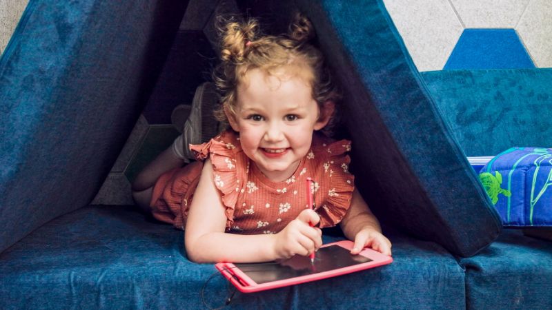 A young girl playing in the Mobile Sensory Accessibility Resource Center