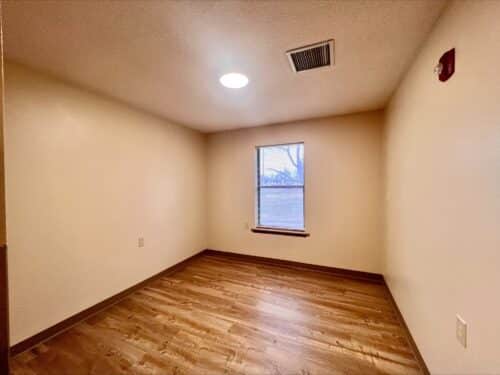 Bedroom in a living space offered through affordable housing services